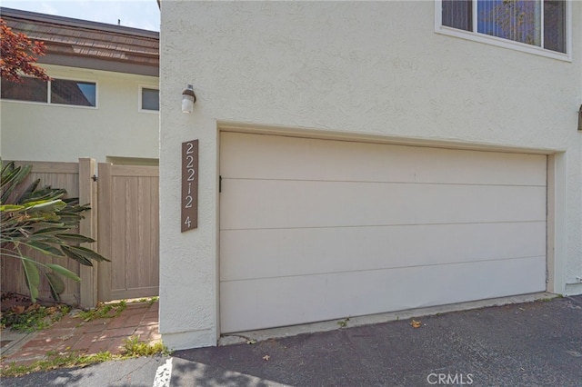 garage featuring fence