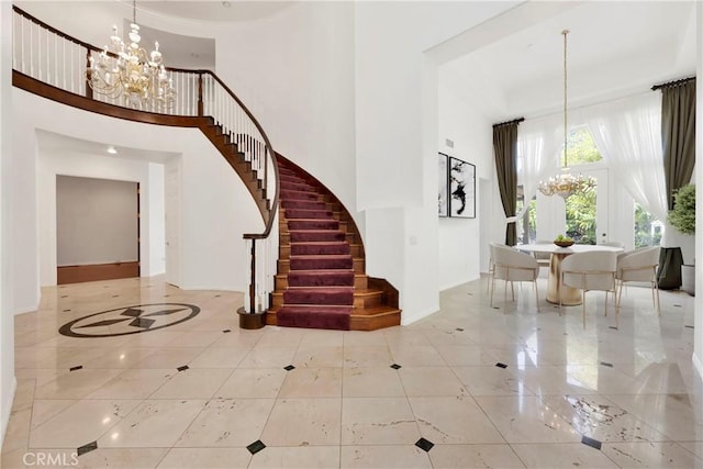 2117 Brittany Park Rd, Camarillo, CA 93012 - entrance foyer with a chandelier, a high ceiling, stairway, baseboards, and tile patterned flooring