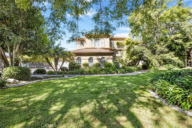 2117 Brittany Park Rd, Camarillo, CA 93012 - view of front of house with a tiled roof, stucco siding, and a front lawn