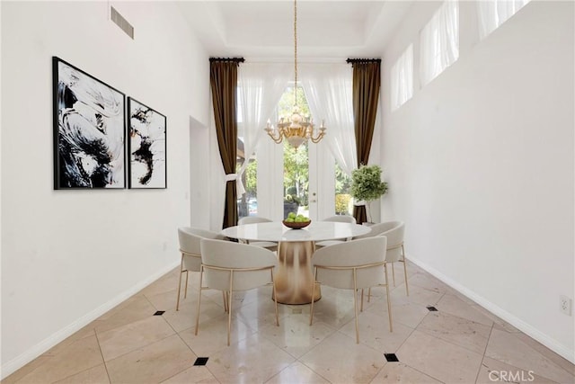 2117 Brittany Park Rd, Camarillo, CA 93012 - dining area with a chandelier, a high ceiling, baseboards, and a tray ceiling