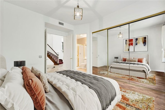 2117 Brittany Park Rd, Camarillo, CA 93012 - bedroom with wood finished floors, a closet, and ensuite bath