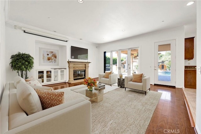2117 Brittany Park Rd, Camarillo, CA 93012 - living area featuring hardwood / wood-style flooring, crown molding, recessed lighting, and a glass covered fireplace