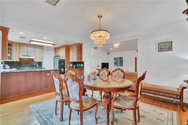 4745 Dunsmore Ave, La Crescenta, CA 91214 - dining space with light wood-style flooring, a chandelier, and recessed lighting