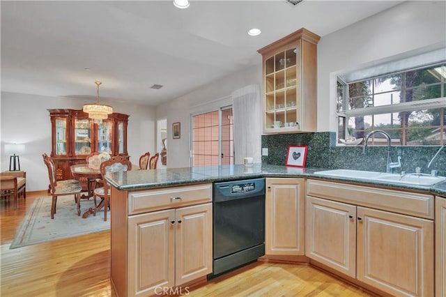 kitchen with dishwasher, a sink, light wood finished floors, a peninsula, and recessed lighting