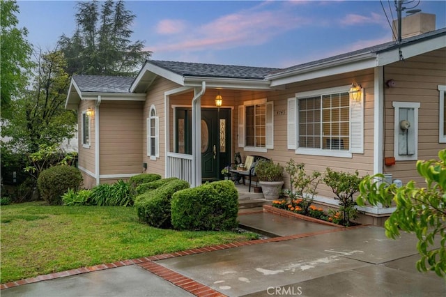 4745 Dunsmore Ave, La Crescenta, CA 91214 - view of front of property featuring covered porch, a front yard, and a shingled roof