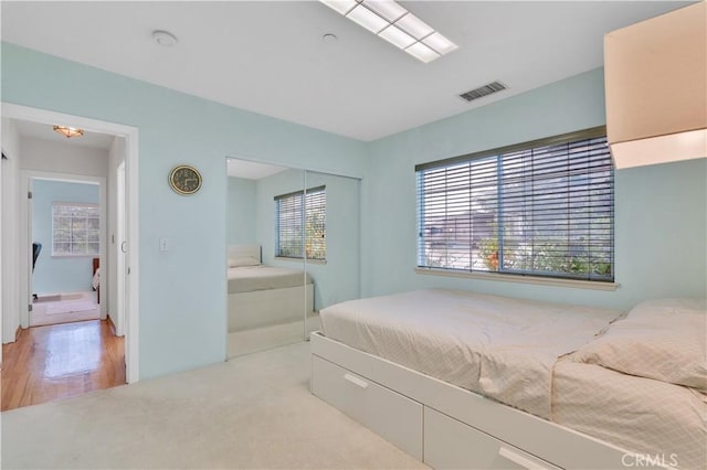 bedroom with a closet and wood finished floors
