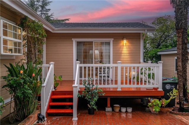 4745 Dunsmore Ave, La Crescenta, CA 91214 - back of house at dusk with a deck, a patio, and a shingled roof