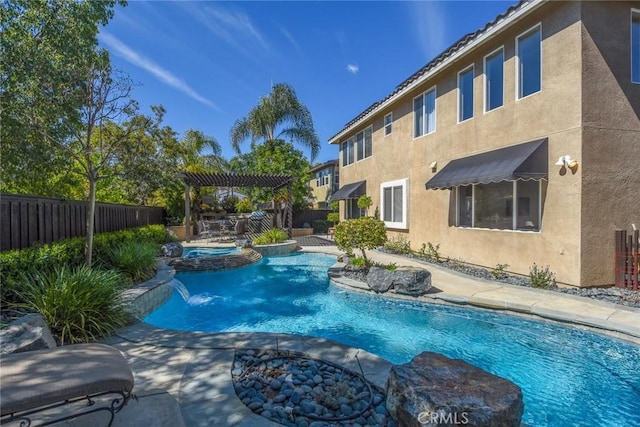 view of pool with a fenced backyard, a pool with connected hot tub, a patio area, and a pergola