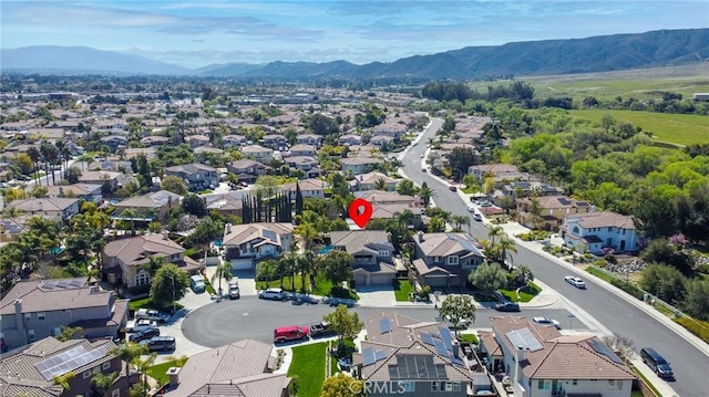 aerial view of residential area with mountains