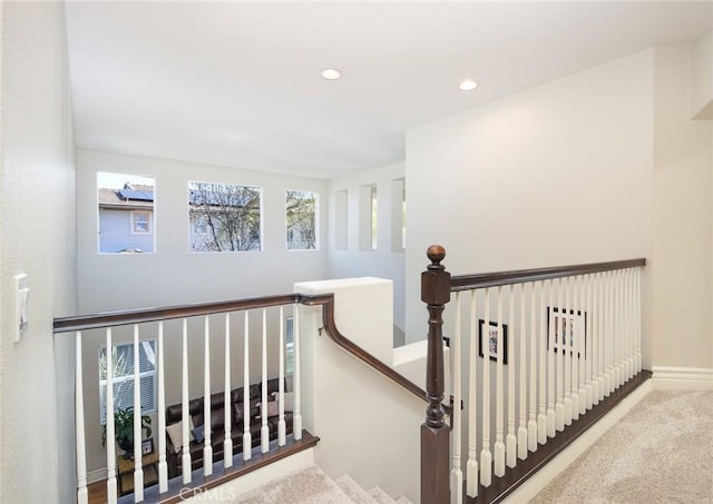 staircase featuring carpet flooring, recessed lighting, and baseboards