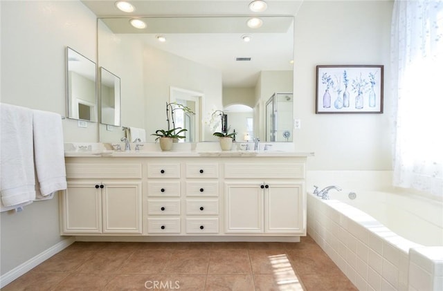 full bathroom with tile patterned flooring, a garden tub, a shower stall, double vanity, and recessed lighting