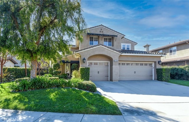 view of front facade with an attached garage, concrete driveway, stucco siding, and a front lawn