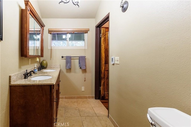 26220 Pine Dell Rd, Idyllwild, CA 92549 - bathroom featuring toilet, tile patterned flooring, baseboards, and double vanity