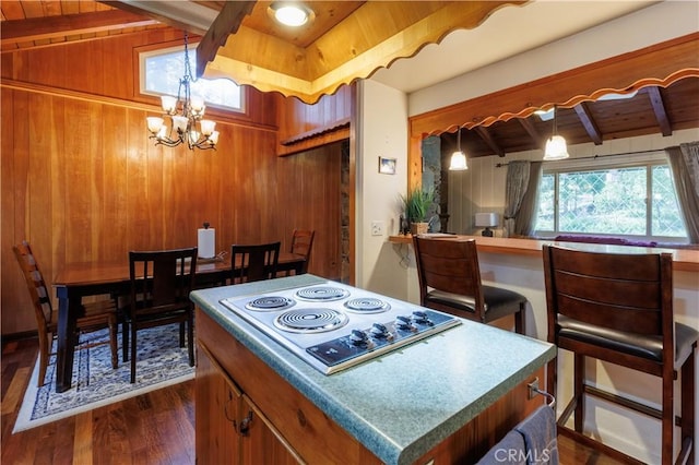 26220 Pine Dell Rd, Idyllwild, CA 92549 - kitchen featuring stainless steel electric cooktop, dark wood finished floors, a chandelier, wooden walls, and wood ceiling