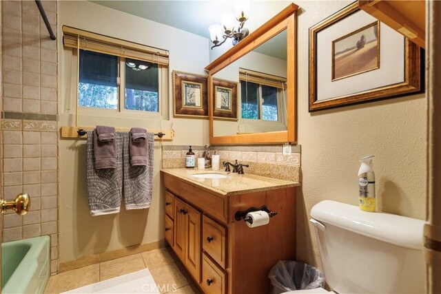 26220 Pine Dell Rd, Idyllwild, CA 92549 - bathroom featuring tile patterned floors, a chandelier, vanity, toilet, and shower / bathtub combination