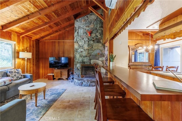 26220 Pine Dell Rd, Idyllwild, CA 92549 - living area with wooden ceiling, a chandelier, wooden walls, and a stone fireplace