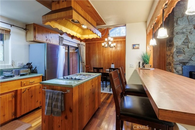 26220 Pine Dell Rd, Idyllwild, CA 92549 - kitchen featuring stainless steel appliances, wood-type flooring, and brown cabinets