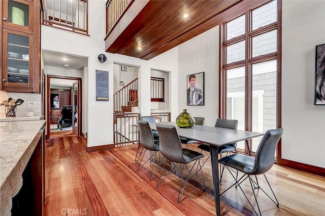 436 32nd St, Manhattan Beach, CA 90266 - dining room with a towering ceiling, light wood-style floors, stairway, and recessed lighting