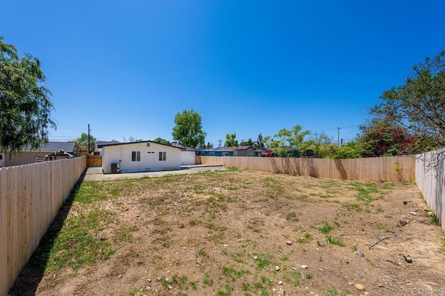 fenced backyard featuring a patio area