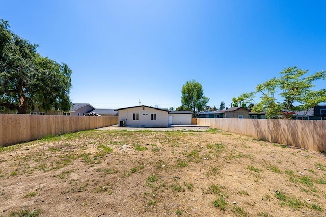 fenced backyard featuring a patio