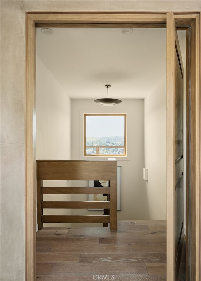 staircase featuring wood finished floors