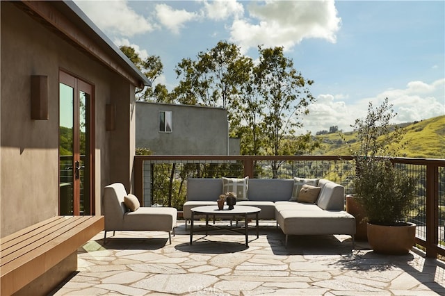 view of patio / terrace with outdoor lounge area and a mountain view