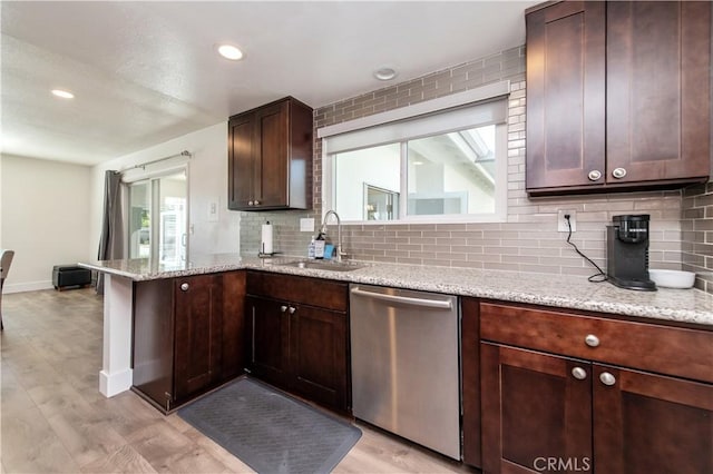 1263 Sandra Ct, Upland, CA 91786 - kitchen featuring stainless steel dishwasher, a sink, backsplash, a peninsula, and light stone counters