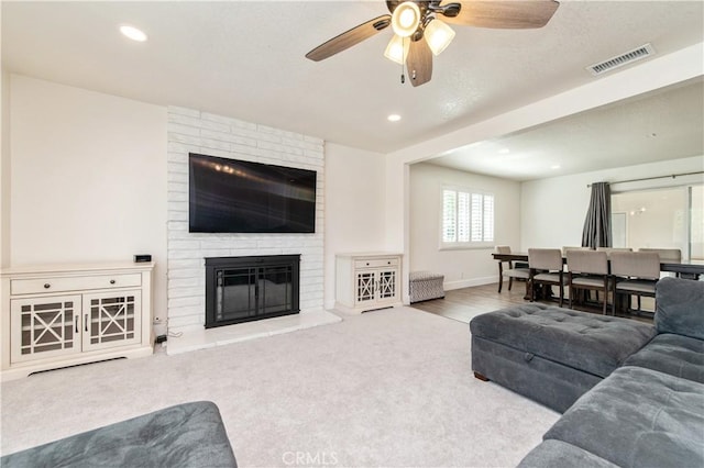 1263 Sandra Ct, Upland, CA 91786 - carpeted living room with a ceiling fan, a brick fireplace, recessed lighting, and baseboards