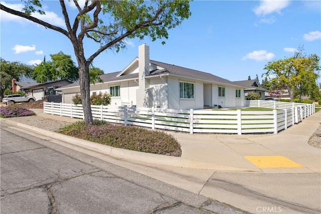 1263 Sandra Ct, Upland, CA 91786 - mid-century modern home featuring a chimney and a fenced front yard