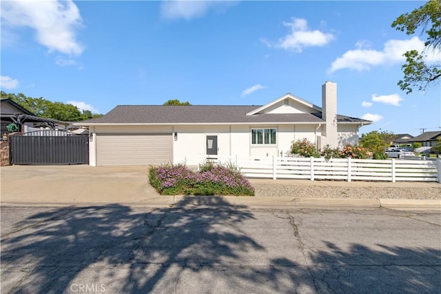 1263 Sandra Ct, Upland, CA 91786 - ranch-style house with concrete driveway, an attached garage, a chimney, and stucco siding