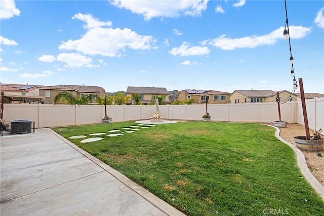 24521 Snapdragon Way, Lake Elsinore, CA 92532 - view of yard featuring a residential view, a patio, and central AC