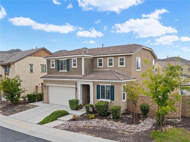 24521 Snapdragon Way, Lake Elsinore, CA 92532 - traditional home with a garage, stucco siding, concrete driveway, and a tiled roof