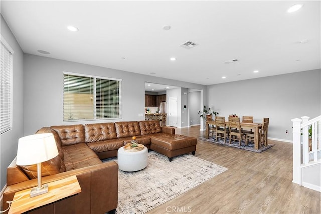 24521 Snapdragon Way, Lake Elsinore, CA 92532 - living room featuring light wood-style floors, baseboards, and recessed lighting