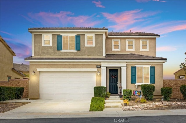 24521 Snapdragon Way, Lake Elsinore, CA 92532 - traditional-style house featuring a garage, concrete driveway, and stucco siding