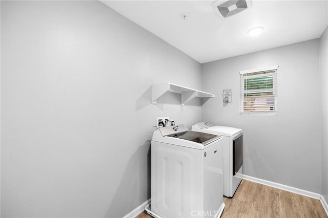 24521 Snapdragon Way, Lake Elsinore, CA 92532 - laundry room featuring independent washer and dryer, light wood-style floors, and baseboards