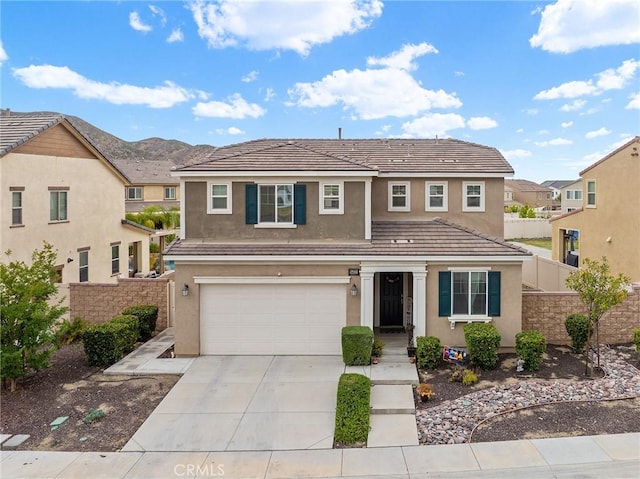 24521 Snapdragon Way, Lake Elsinore, CA 92532 - traditional home featuring a garage, driveway, and stucco siding