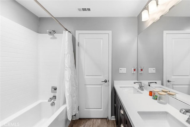 24521 Snapdragon Way, Lake Elsinore, CA 92532 - bathroom featuring shower / bath combo with shower curtain, wood finished floors, and double vanity