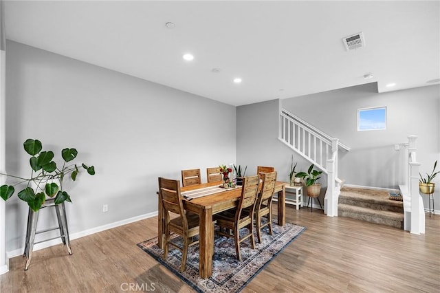 24521 Snapdragon Way, Lake Elsinore, CA 92532 - dining space with stairway, wood finished floors, recessed lighting, and baseboards