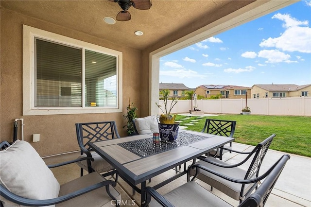 24521 Snapdragon Way, Lake Elsinore, CA 92532 - view of patio featuring outdoor dining space, ceiling fan, and a residential view