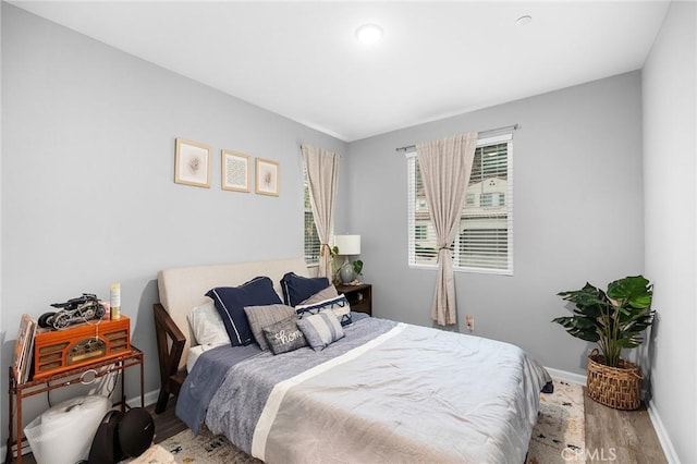 24521 Snapdragon Way, Lake Elsinore, CA 92532 - bedroom featuring wood finished floors and baseboards