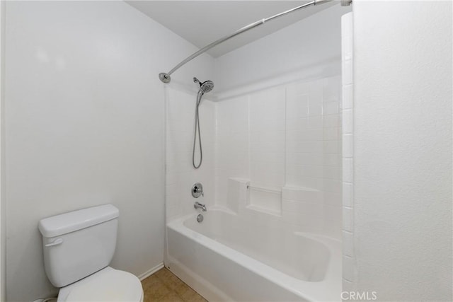 full bathroom with toilet, washtub / shower combination, and tile patterned floors