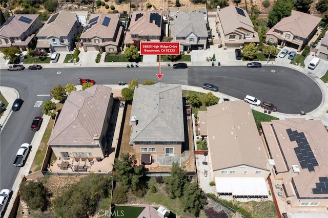 aerial view of property and surrounding area with nearby suburban area