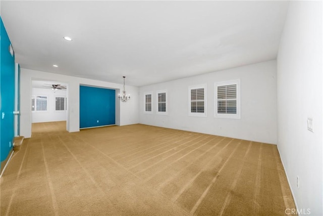 spare room with carpet, a chandelier, recessed lighting, and ceiling fan