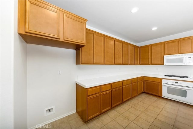 kitchen with white appliances, light tile patterned floors, light countertops, brown cabinets, and recessed lighting