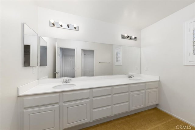 bathroom featuring double vanity