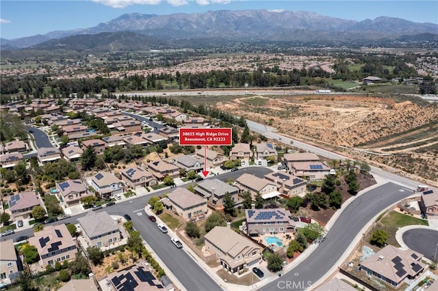 aerial view of residential area with a mountain backdrop