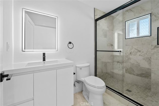 full bathroom featuring a shower stall, toilet, marble finish floors, and vanity