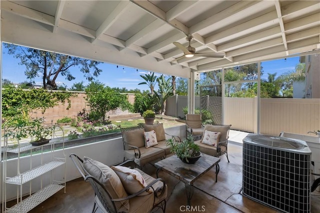 view of patio with an outdoor living space, central AC, a fenced backyard, and ceiling fan