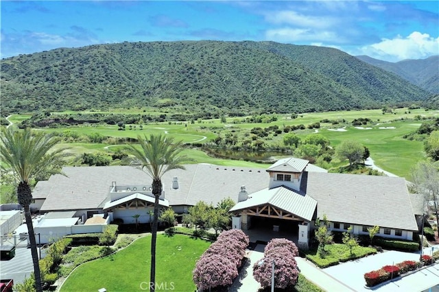 aerial view of a mountainous background and a golf course