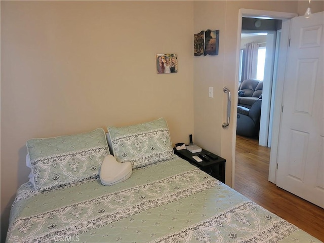 bedroom with wood finished floors